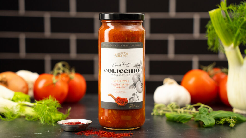 CPG food brand marketing photo showcasing high-end tomato sauce with rich flavor cues of tomato, fennel, saffron, and garlic. The image emphasizes the premium brand's sophisticated presentation and luxurious, aromatic ingredients. Ideal for gourmet cooking and adding elegance to any dish, this professional food videography and photography highlight your CPG product's appeal.