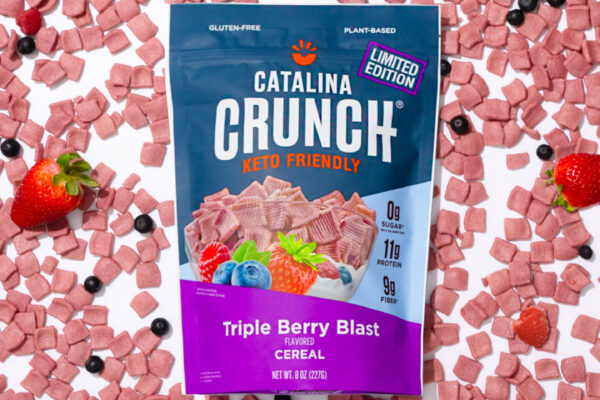 Triple Berry Cereal Centrally featured cereal brand surrounded by a full frame of fruity cereals, highlighting its packaging design and product variety. Ideal for attracting attention in food brand marketing campaigns.