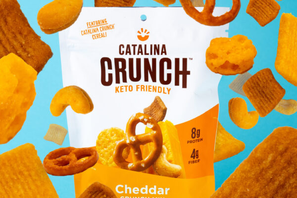 Crunch Mix on Blue Close-up of crunchy snack mix showcasing its texture, with the product centered on a blue background for vibrant contrast.