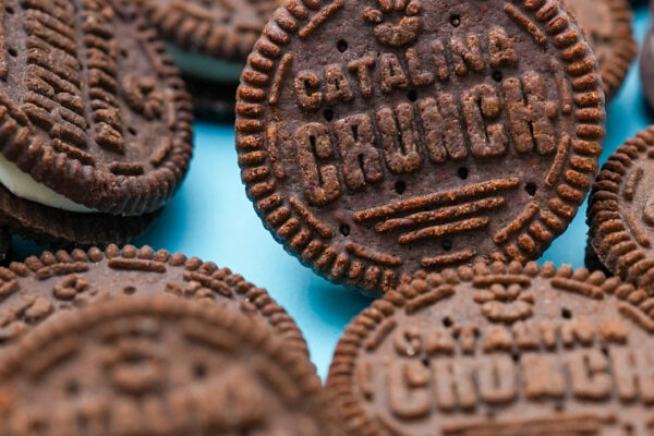 Cookie Close Up Close-up shot of cookie product on a vibrant blue surface, highlighting its texture and appeal.