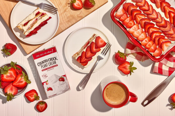 Country Crock Plant Butter - Foodist Films - Full Res V3 - 20 Strawberry no-bake cake on a white surface, featuring red accents and a beautifully styled product, highlighting its fresh and appealing presentation.