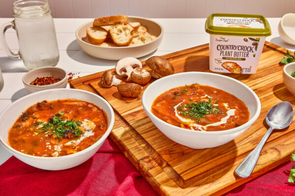 Country Crock Plant Butter - Foodist Films - Full Res V3 - 5 Lasagne soup elegantly styled in rustic bowls on a wooden cutting board, perfect for food CPG brands seeking to highlight hearty and innovative pasta dishes in their marketing visuals.