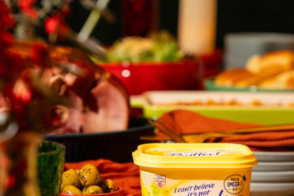 Product on Holiday Table Artfully presented butter spread product showcased on a beautifully styled holiday table, enhancing the festive ambiance and culinary appeal.