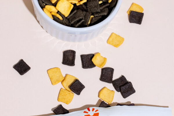 NationalCerealDayDominos00316 CPG product on a blank surface with harsh flash lighting to highlight texture.