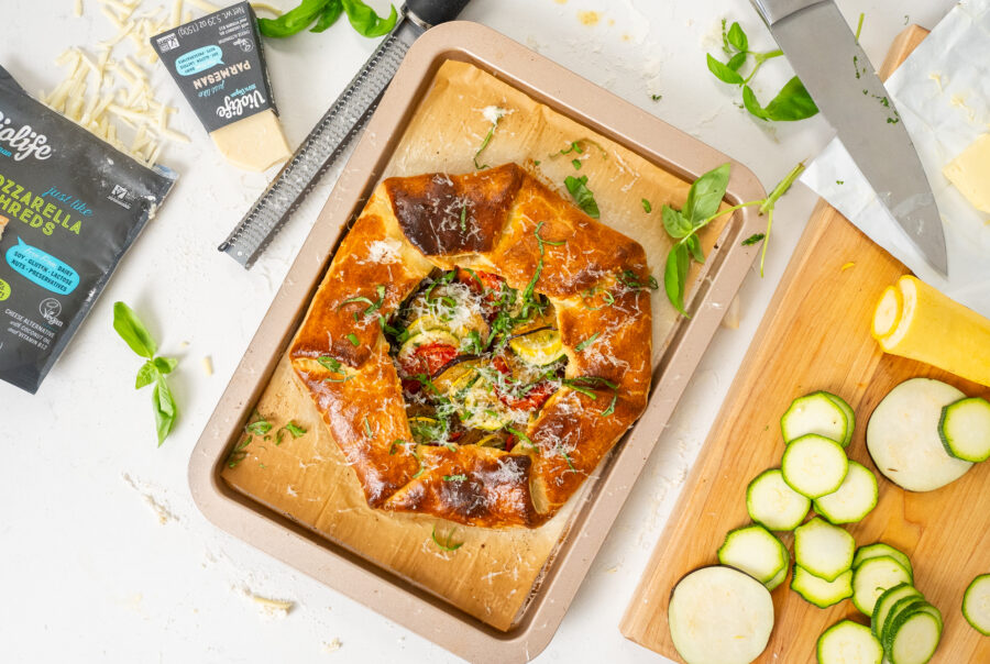 Ratatouille gallette styled on a marble countertop to effectively market the food brand featured for social media. Styled with extra ingredients, herbs.